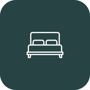 Bed icon on dark green background.